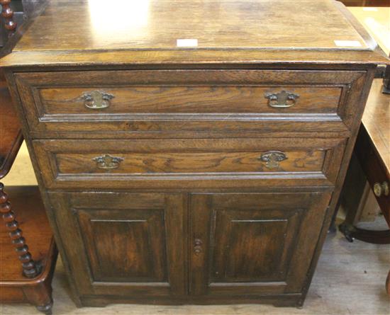 Panelled oak cupboard